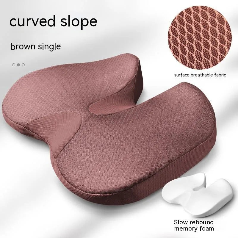 Curved bevel anal support seat cushion in solid colour on a car seat.