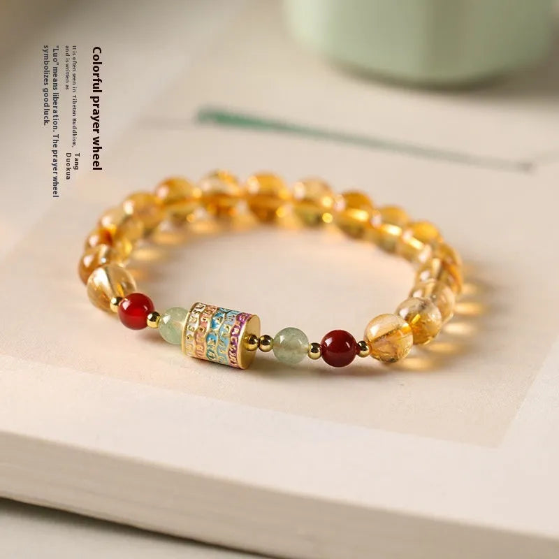 Yellow citrine bracelet with prayer wheel centrepiece and 8mm round beads