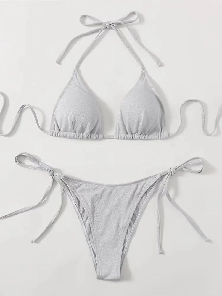 Women's split bandage style bikini swimsuit in polyester fabric on a mannequin.