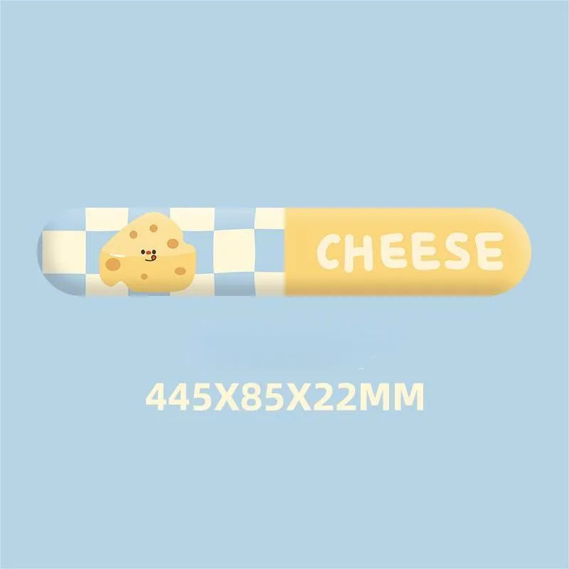 Cartoon cheese mouse pad with wrist strap support on a desk, featuring milk silk fabric and rubber base