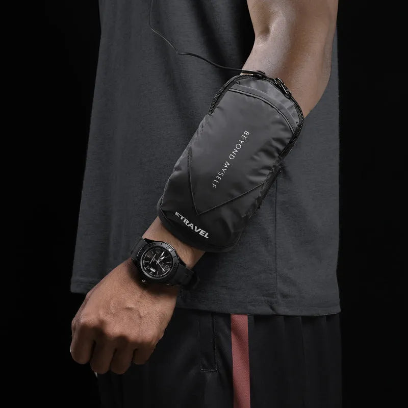 Black reflective running arm bag with adjustable strap, shown on an arm.