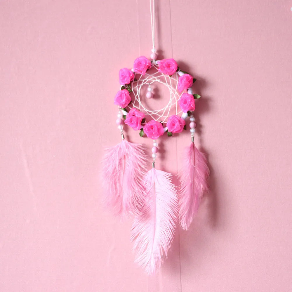Pink ostrich feather dreamcatcher wind chime wall ornament measuring 10cm