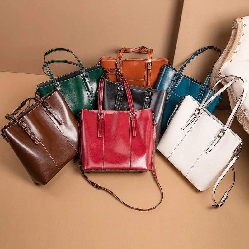 Brown genuine leather retro women's tote bag with multiple zipper pockets and three shoulder straps.