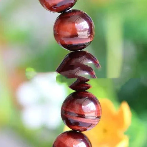 Wood alexandrite tigereye stone hand bracelet with geometric round beads in lightning cat's eye colour.