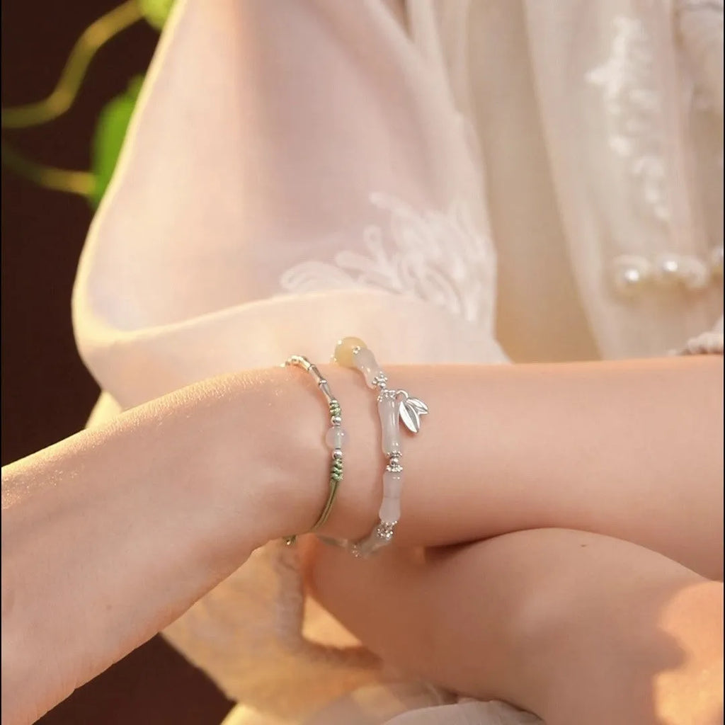 Natural Tianshan green bamboo sterling silver bracelet for women with antique style.