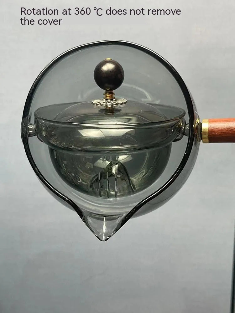 Transparent borosilicate glass teapot with wooden handle and removable infuser for rotary tea brewing