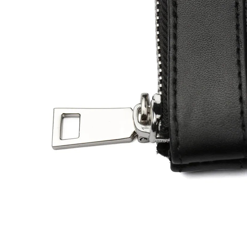 Black genuine leather men's clutch wallet showing first-layer cowhide texture and rectangular 20x10cm shape