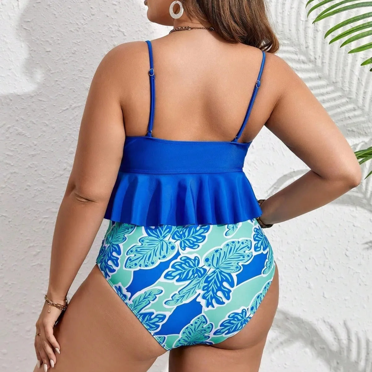 Blue women's bikini swimsuit set with a top and briefs-style shorts on a mannequin.