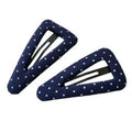 French retro dot pattern barrettes in triangle and water drop shapes with dark denim or polka dot designs
