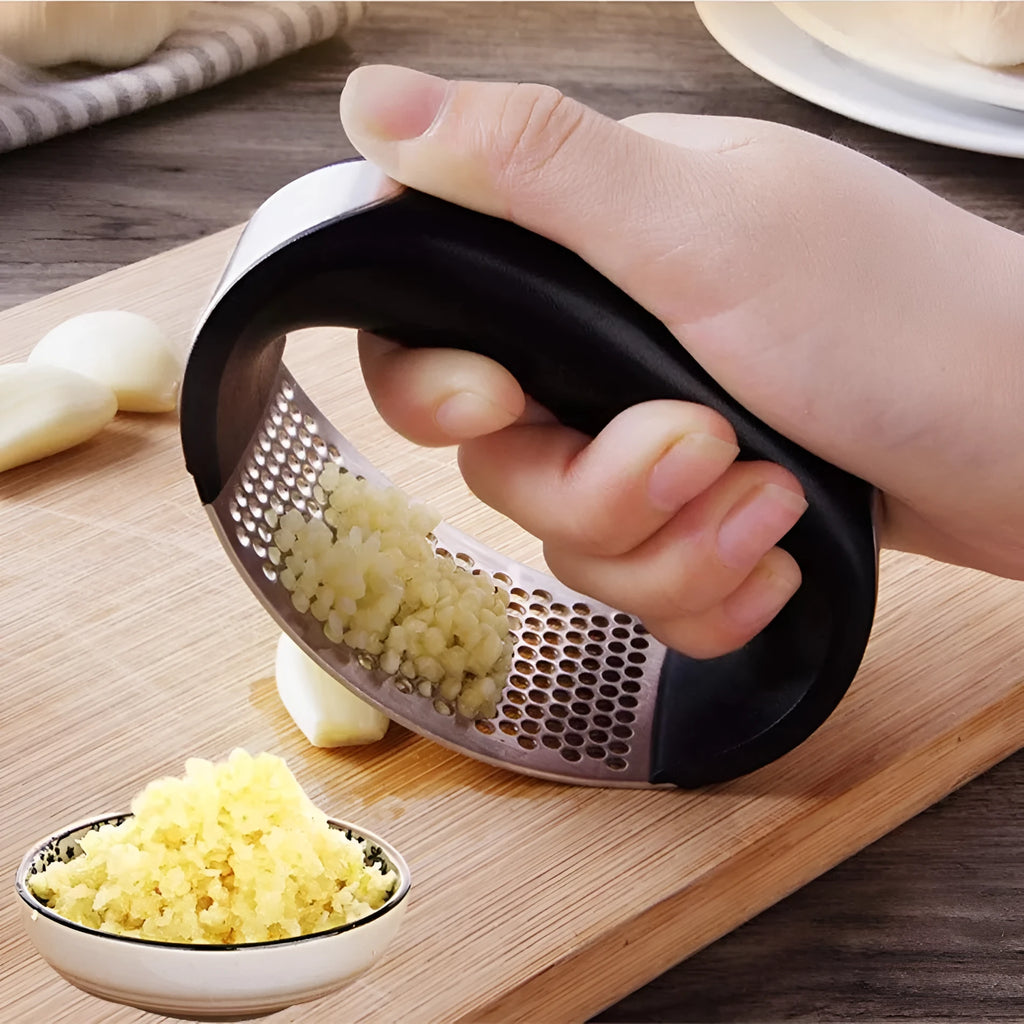 Stainless steel manual garlic press with ergonomic non-slip handle in assorted colours