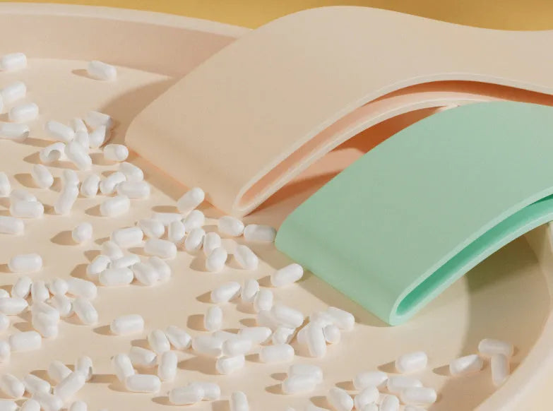 Green, beige, orange, and pink plastic resistance bands showing different tension levels from 10 to 30 pounds.