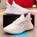 Men's white flying fabric breathable sneakers with mesh lining, round toe and low upper design on a neutral background.