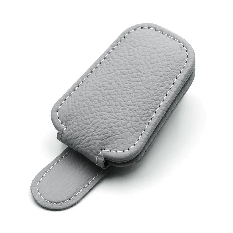 PU leather sunglasses clip holder attached to a car sun visor