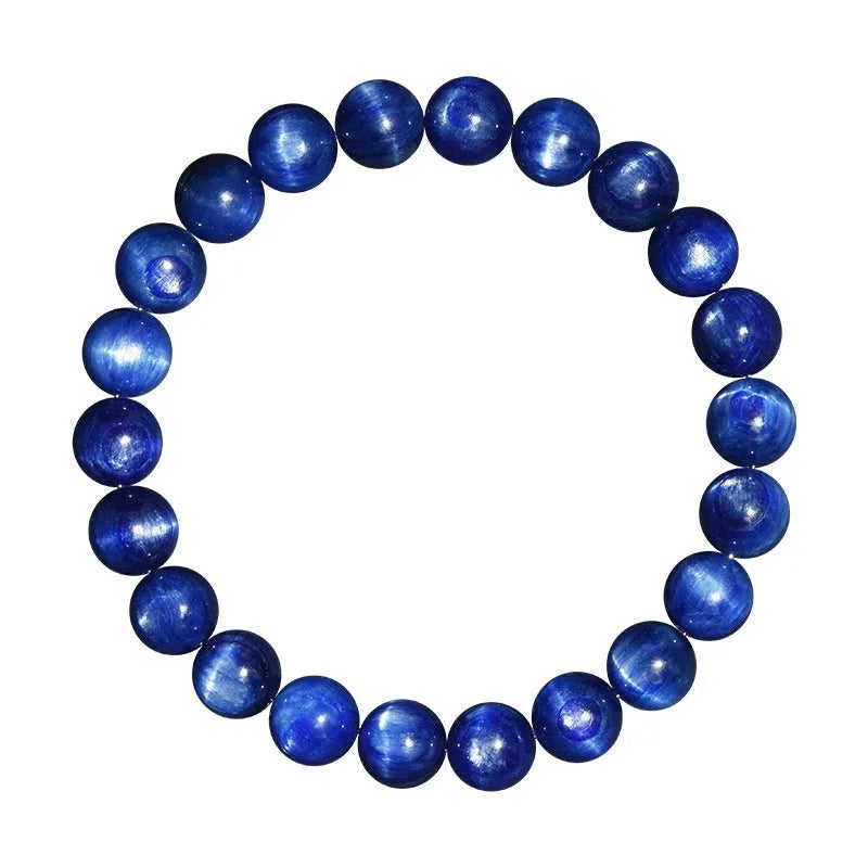 Natural blue crystal ball bracelet with geometric Ruyi design on a wrist.
