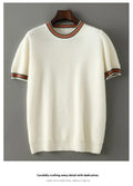 Men's short sleeve pure wool sweater in round neck pullover style on a grey background.