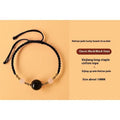 Hand-woven red rope bracelet with Hetian jade beads and intricate charm detailing.