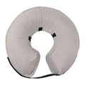 Blue inflatable soft recovery collar for a dog after surgery.