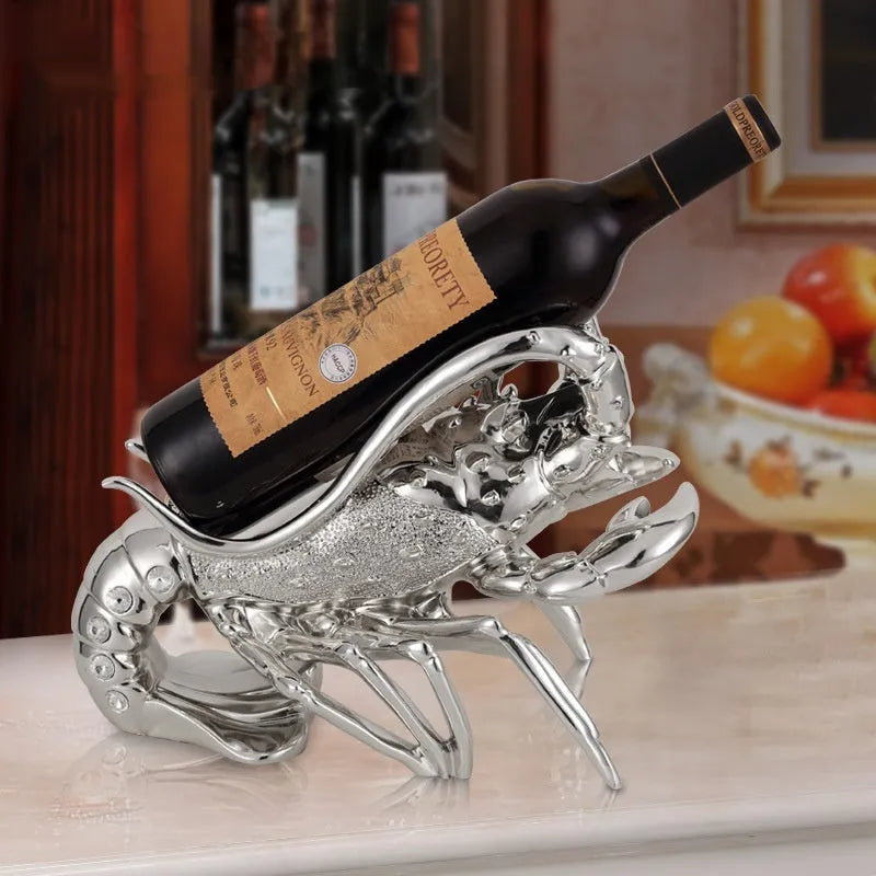 Lobster-shaped decorative wine rack ornament in rose gold or silver holding wine bottle