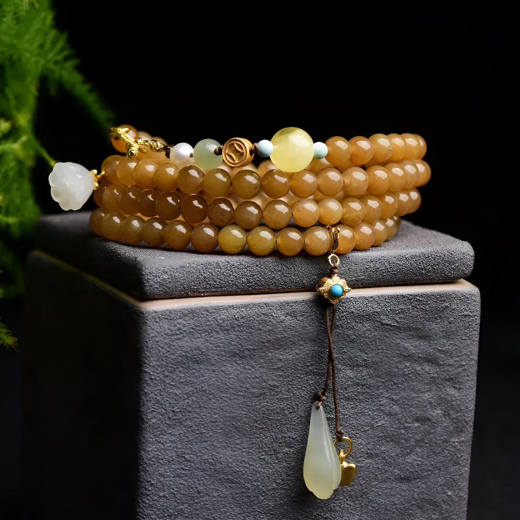 Women's water green pine jade bracelet with 6mm round beads and leaf-shaped sequin details.