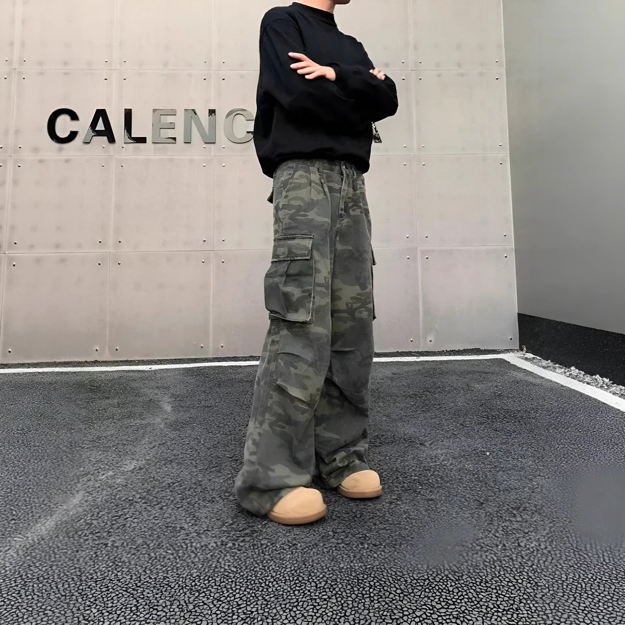 Cotton blend cargo trousers with washed camouflage print and multiple pockets.