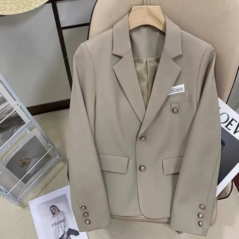 Women's black polyester suit coat with loose fit design and long sleeves for smart casual wear