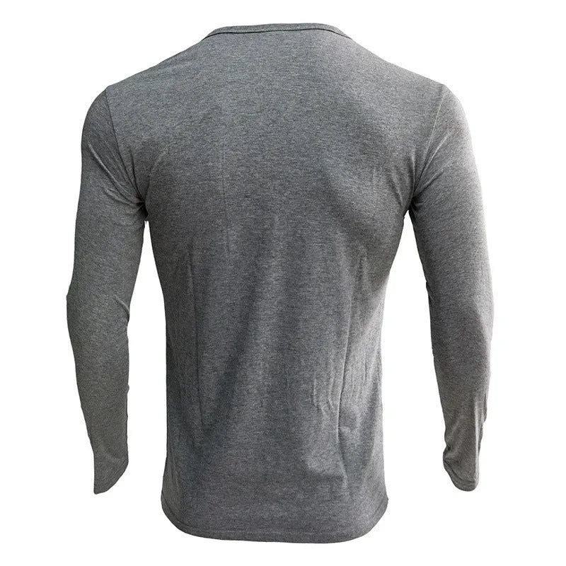 Men's solid colour cotton blend henley shirt with long sleeves and buttoned placket.
