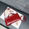 Genuine leather messenger shoulder bag in Wine Red, horizontal square shape, visible sewing thread detailing