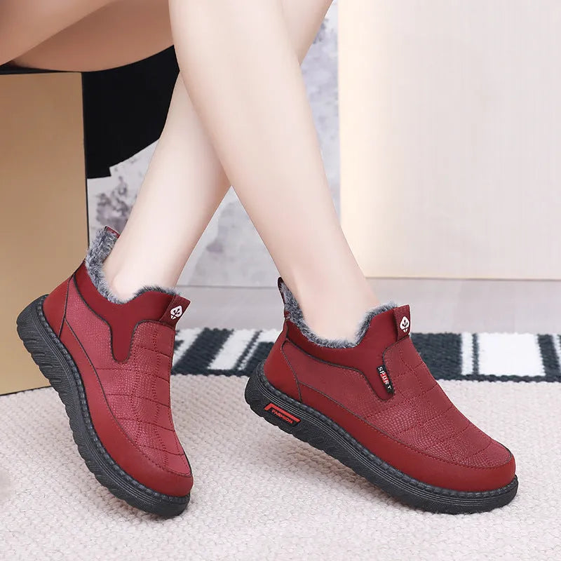 Women's black casual flat ankle boots with round toe and low shaft on a white background.