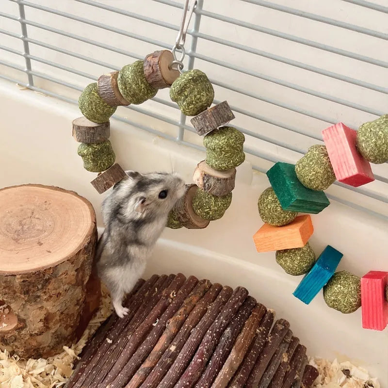 Hamster chew toy with two straw ball rings - one colourful sequin design, one natural applewood