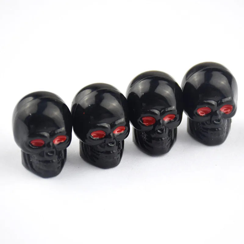 Black rubber tubeless car valve cover on a tyre valve stem