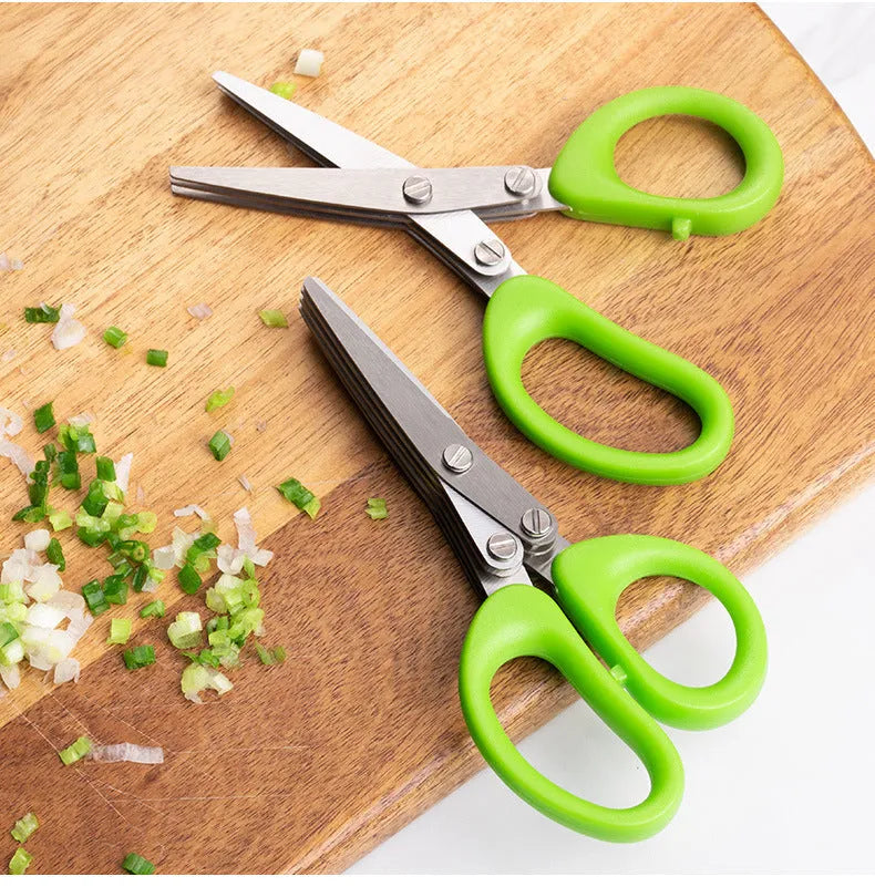 Green multi-layer stainless steel kitchen scissors for cutting herbs and green onions.