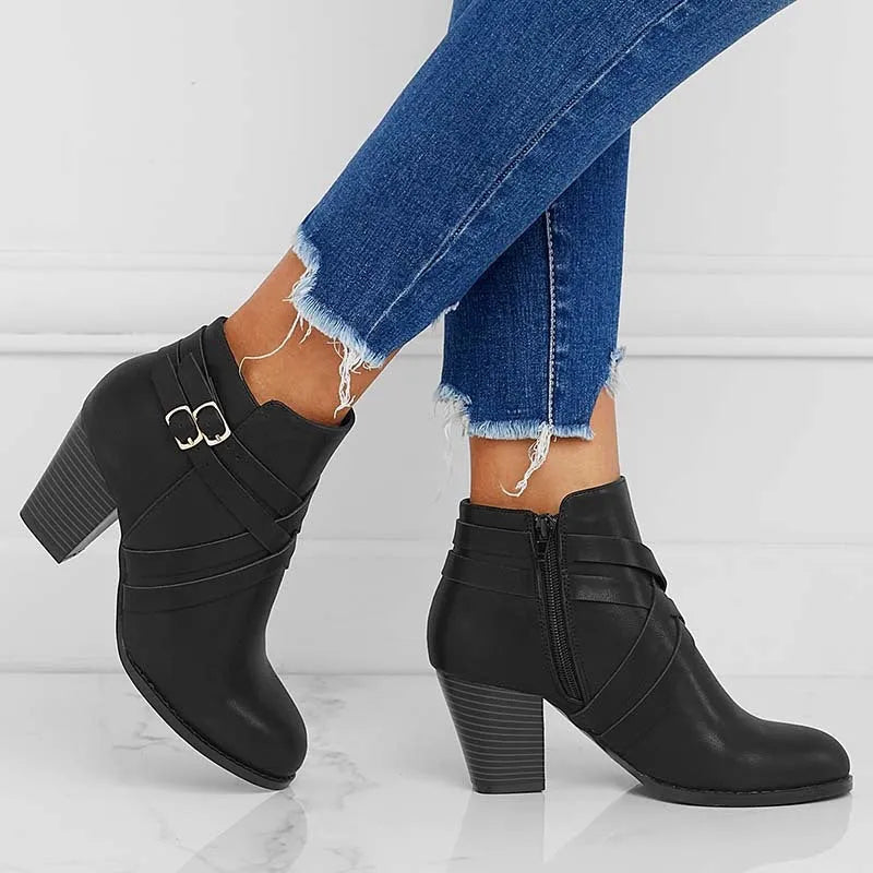 Grey women's plus size ankle boots with a 7cm chunky heel, side zipper, and belt buckle detail.