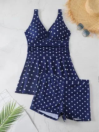 Blue polka dot print women's plus size two-piece swimsuit with bikini briefs style.
