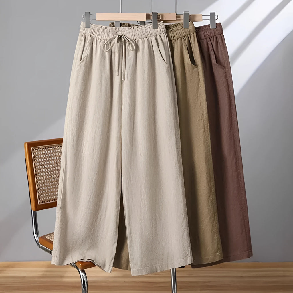 Women's apricot-coloured straight-leg casual trousers with an elastic waistband and white lace-up drawstring detail.
