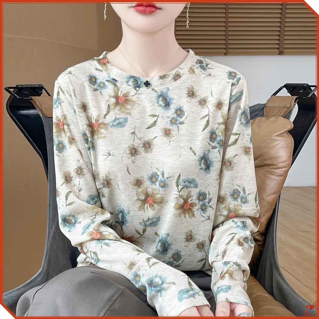 Women's round neck pullover top in a floral print Tencel cotton knitted fabric.