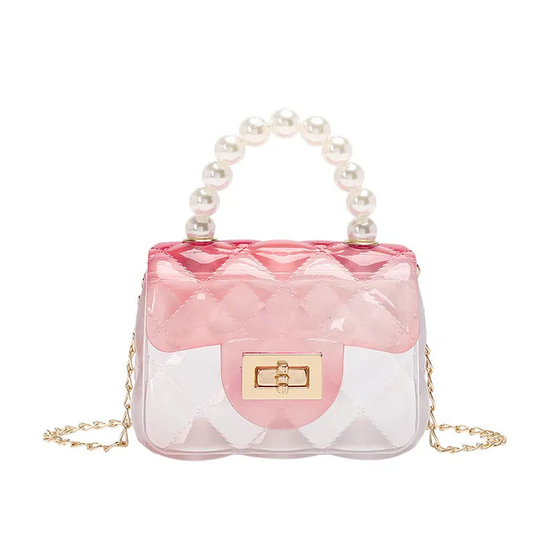 Mini kids crossbody bag in soft PVC with horizontal square shape, available in six colours including yellow, green, blue, black, and pink.