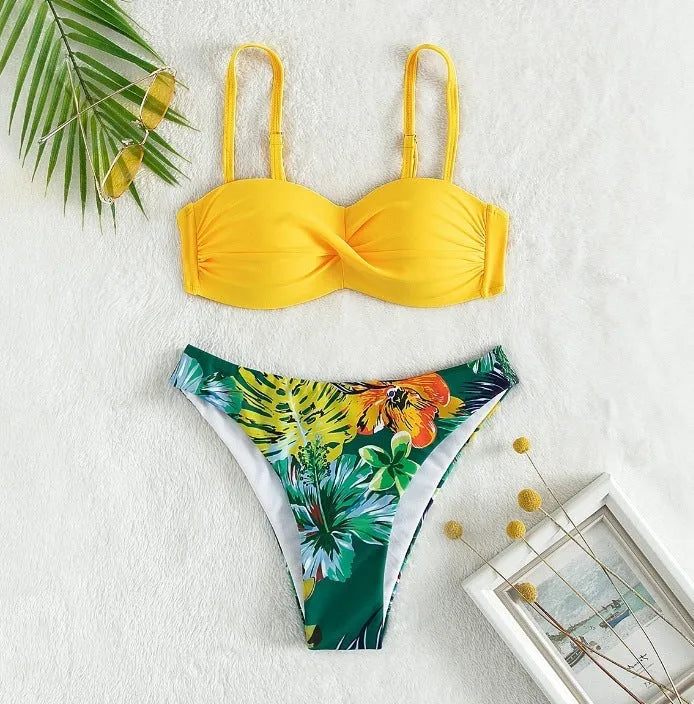 Split push up hard bag bikini swimsuit with matching briefs in multiple colours on a mannequin.