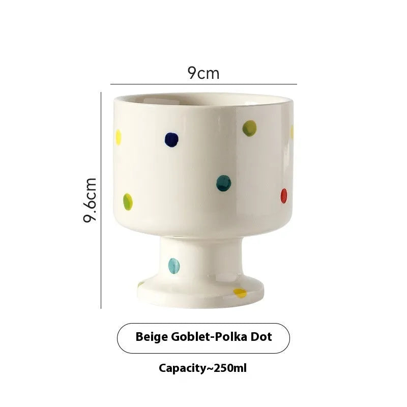 Hand-pinched irregular ceramic mug in a solid colour, showing its unique shape.
