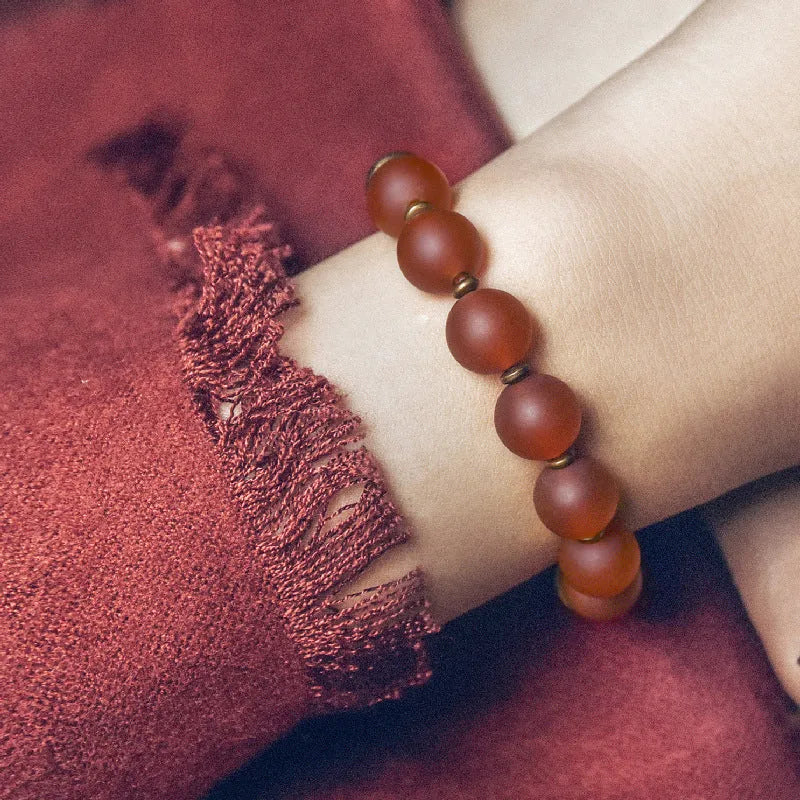 Retro ethnic style couples bracelet with natural green agate beads shown on a wrist.