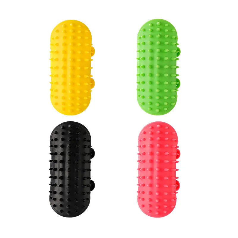 Black silicone cat grooming comb with rounded teeth and adjustable mounting strap for table legs.