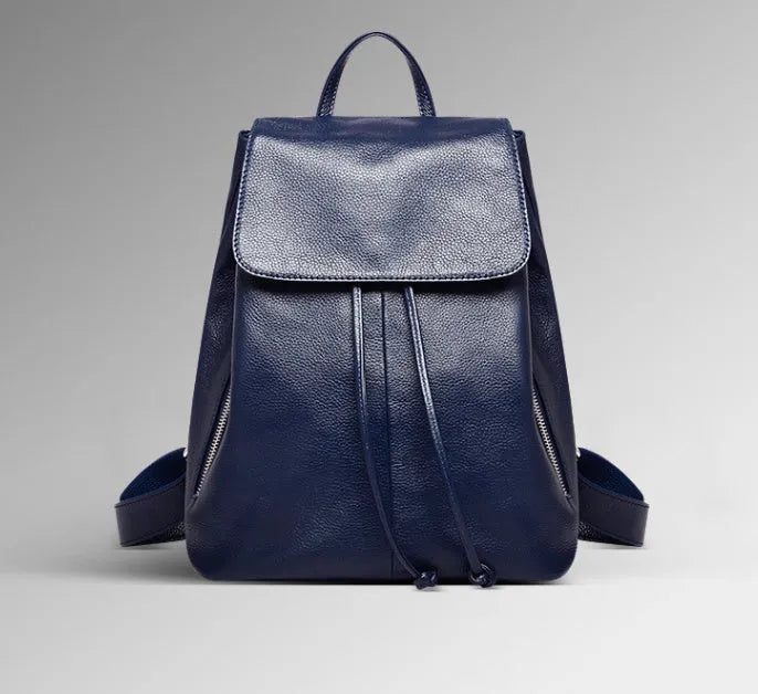 Black genuine leather women's backpack with street trend style and multiple internal pockets.