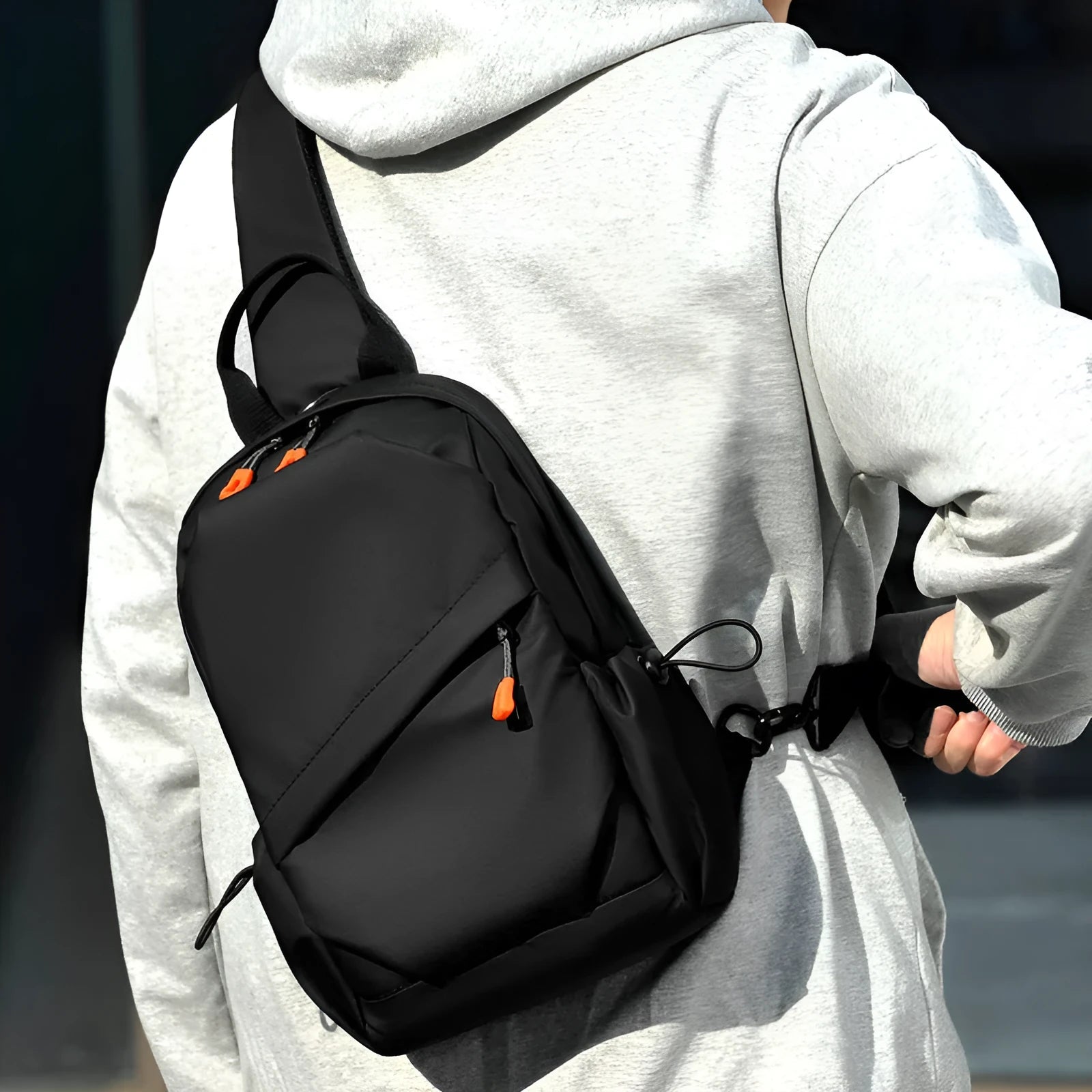 Mens black casual crossbody bag with single shoulder strap, made from waterproof polyester