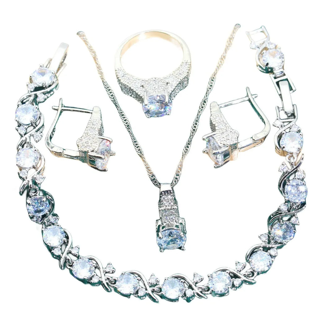 Bridal zircon jewellery four-piece set showing necklace, bracelet, earrings and ring with water wave chain