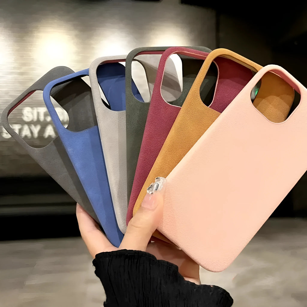 Solid colour suede-effect iPhone case in matte finish showing light grey, dark grey, red, blue, green and orange options.