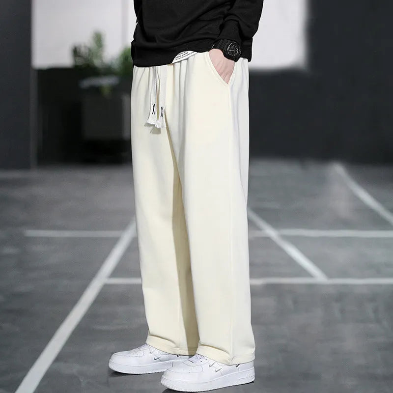 Men's grey casual trousers with multiple pockets showing high waist design and full length