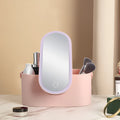 Pink gradient portable makeup storage box with built-in LED mirror, showing USB port and compact dimensions.
