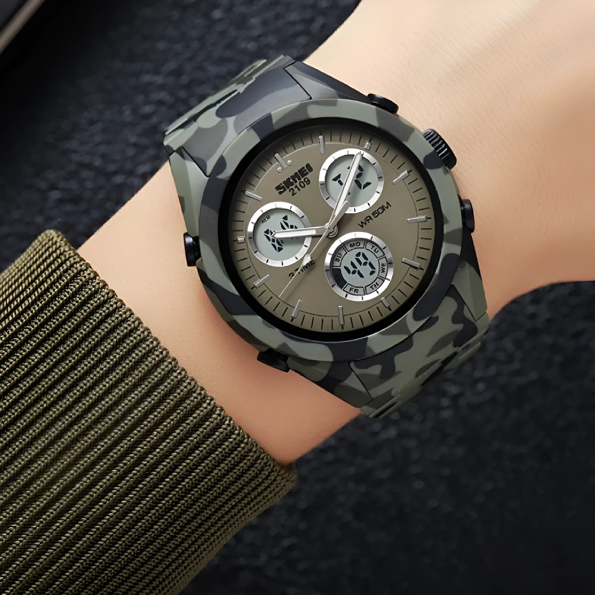 Electronic unisex casual watch with a camouflage strap, showing resin mirror and stainless steel pushers.
