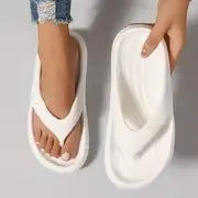 Women's black EVA flip flops with thick sole and textured footbed, shown from above.