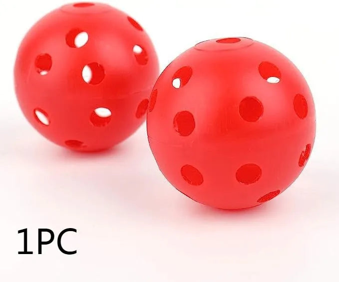 Multi-colour 42mm diameter golf practice balls with 26-hole design in a net pocket