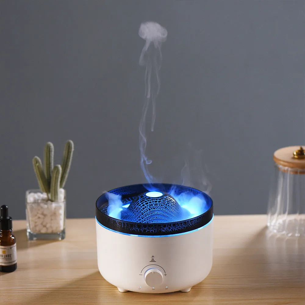 White columnar simulated flame volcano humidifier with remote control on wooden surface